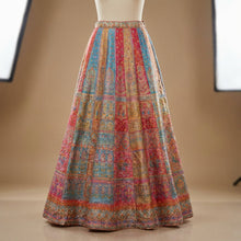 Load image into Gallery viewer, Create a high-end fashion product shot of the 'NINA SKIRT' in a luxurious studio setting. Use softbox lighting to evenly illuminate the shimmering crystal-adorned fabric, emphasizing its intricate details and flowing maxi length. Capture from a slightly el